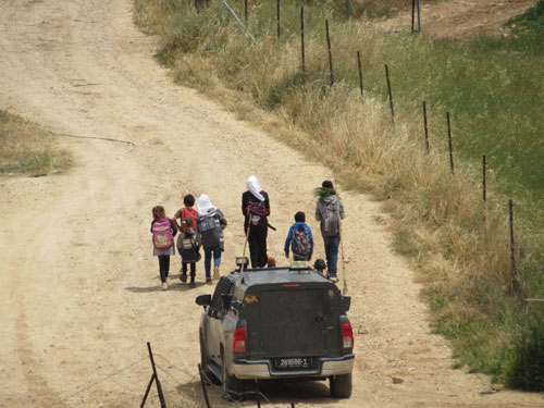 Figure 3 Palestinian schoolchildren escorted by Israeli soldiers